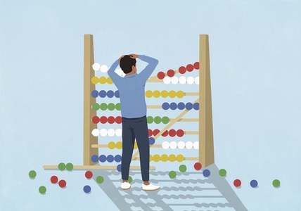 Surprised man watching beads fall from large