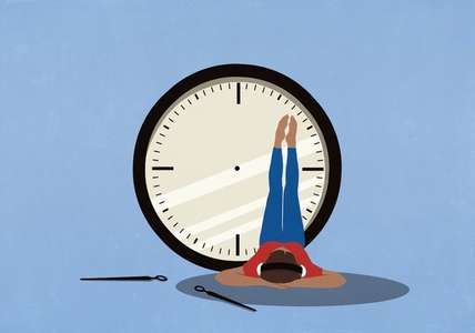 Woman with headphones listening to music relaxing with legs up