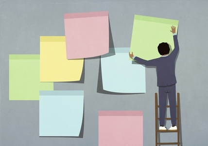Businessman on ladder hanging large multicolored adhesive notes Businessman on ladder hanging large multicolored adhesive notes