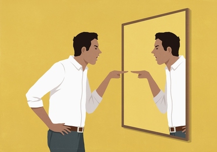 Angry man pointing and arguing at his reflection in mirror