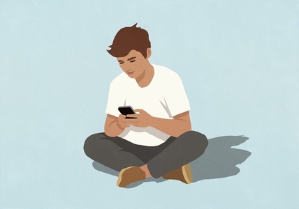 Man using smart phone sitting cross legged