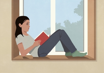 Woman reading book on sunny window ledge at home Woman reading book on sunny window ledge at home