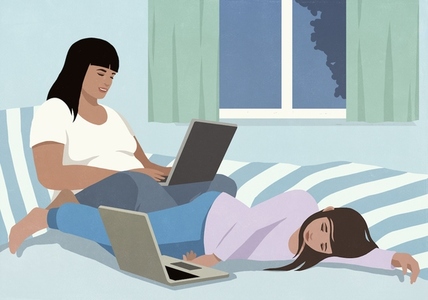 Woman working at laptop next to tired daughter sleeping