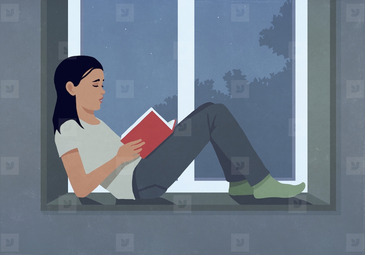 Woman reading book at dark window ledge at night