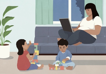 Mother working at laptop on living room Mother working at laptop on living room