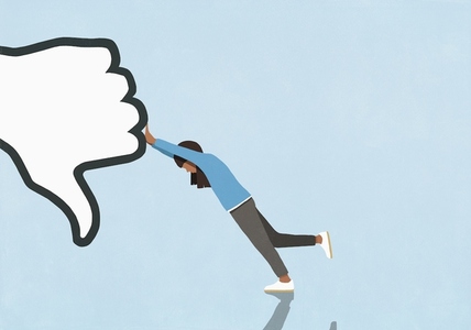 Woman resisting pushing thumbs down symbol Woman resisting pushing thumbs down symbol