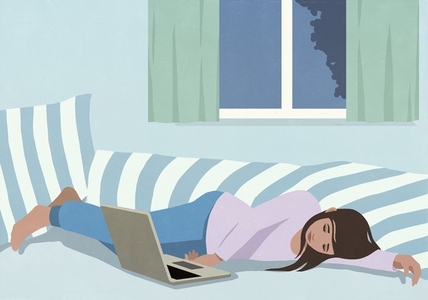 Tired teenage girl sleeping next to laptop on bed Tired teenage girl sleeping next to laptop on bed