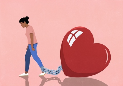 Large red heart shackled to womans ankle Large red heart shackled to womans ankle