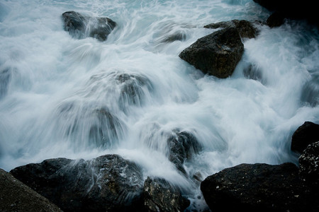 Rushing water flowing over rocks