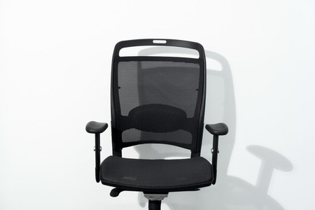 Office chair and white wall