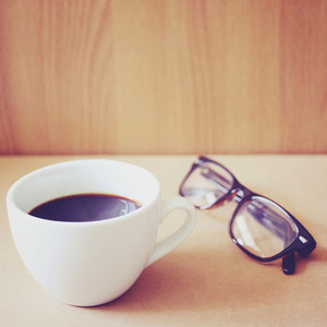 Hot coffee and eyeglasses