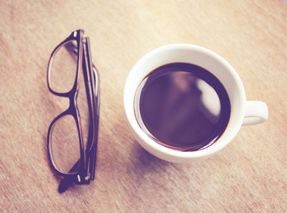 Hot coffee and eyeglasses
