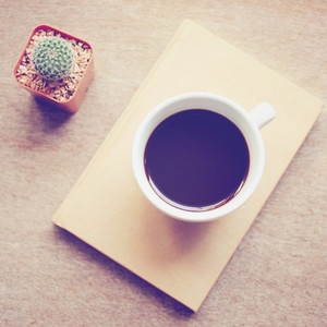 Black coffee on notebook