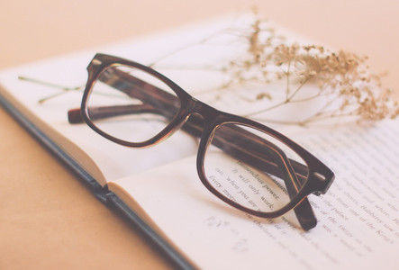Eyeglasses and book