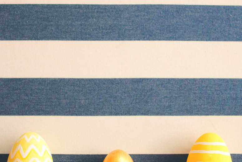 Yellow easter eggs on striped
