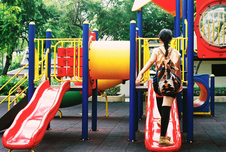 Asian girl at park playground
