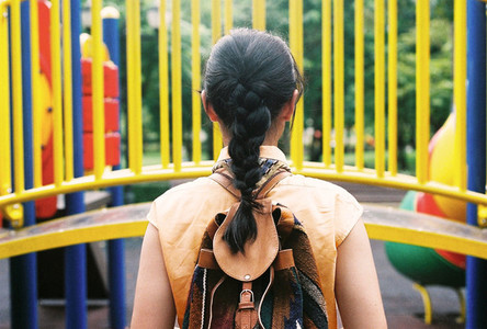 Young girl in back at playground