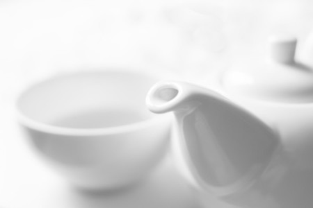 White a cup with teapot