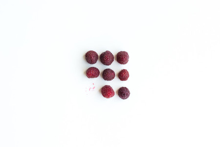 Rasberries on a white background