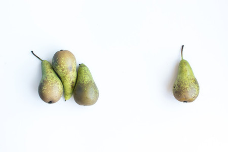 Four green pears isolated