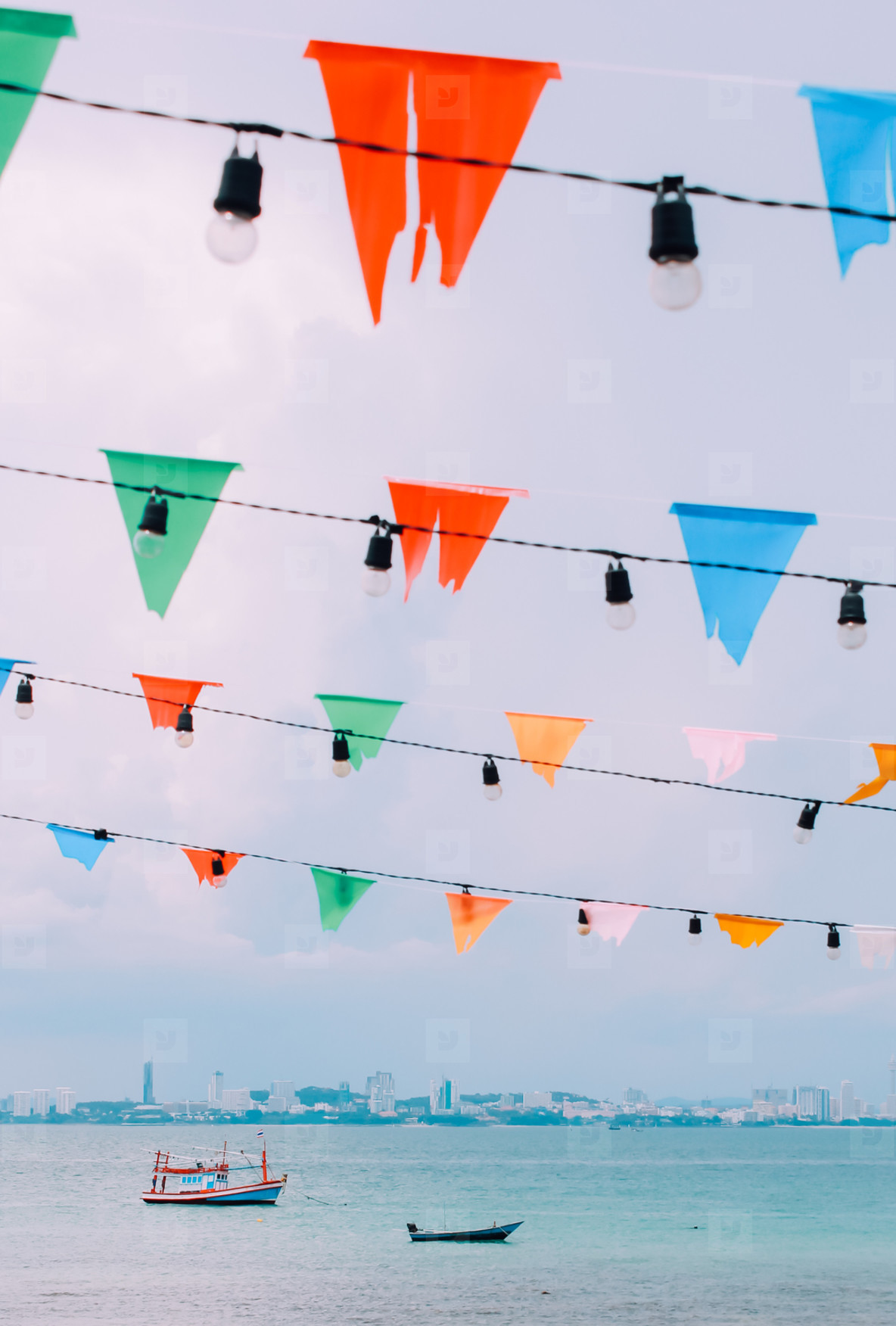 Colorful bunting flags with sea