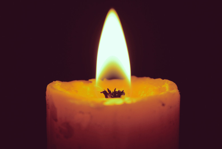 Burning candles on black