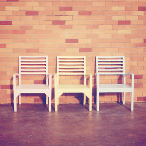 chairs with brick wall
