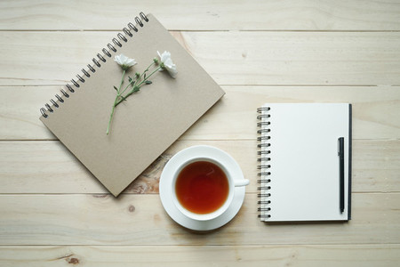 cup of tea and opened notebook