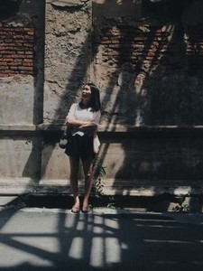 Girl standing in front of a wall