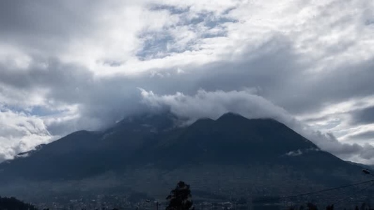 Clouds moving over Mountain peak