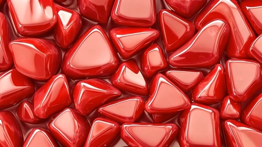 A close up view of shiny Red Aventurine triangular stones