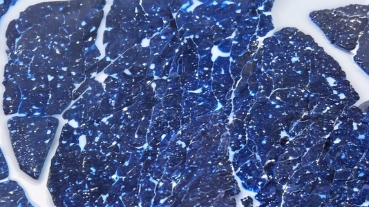 Close up of shimmering blue Sodalite mineral fragments