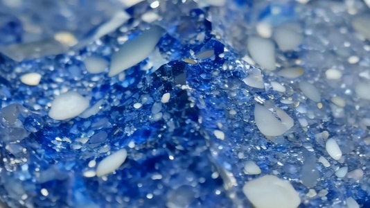 A close up view of a blue Sodalite mineral with a glossy surface
