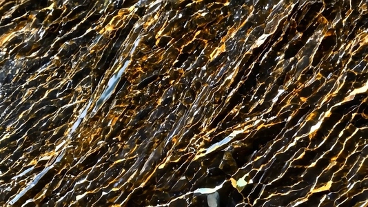 A close up view of shimmering textured rock formations