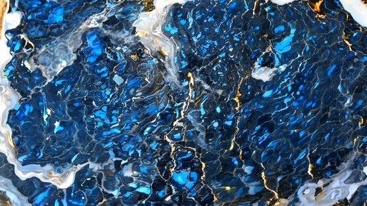 A close up view of a vibrant blue and black abstract pattern
