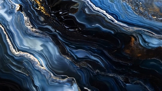 An abstract close up of swirling blue and black patterns