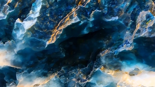 A close up view of a vibrant blue mineral with intricate texture