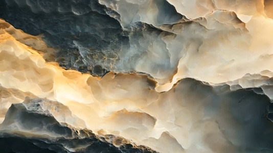 An abstract image showcasing swirling patterns of cream beige