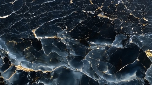 A close up view of a textured black surface