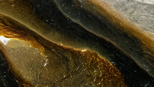 Close up view of flowing water with rich textures and colors