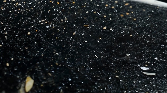A close up view of a dark textured South Onyx surface