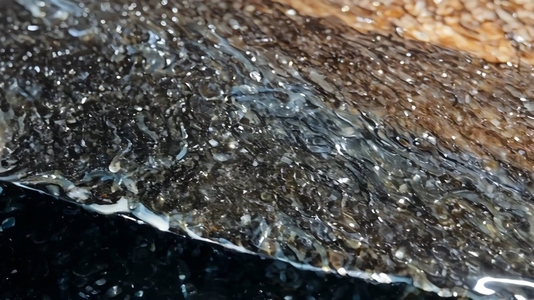 Close up of a South Onyx textured surface with glistening