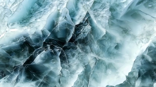 Close up view of a textured mineral surface with shades of green