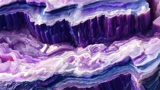 A close up view of a stunning purple Sugilite agate stone