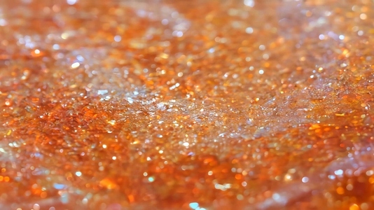 A close up view of a shimmering sunstone surface with sparkling