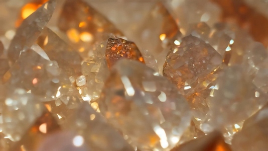 Close up view of sparkling sunstone orange and clear crystals