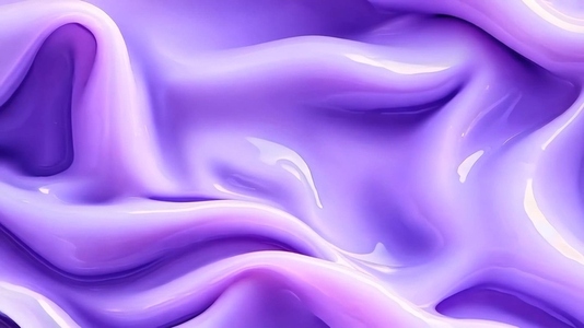 A smooth flowing texture of purple liquid or fabric