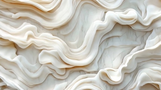 Close up of layered flowing white fabric creating abstract