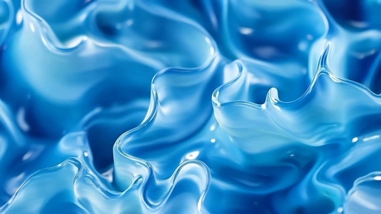Close up of flowing blue liquid with smooth  wavy textures