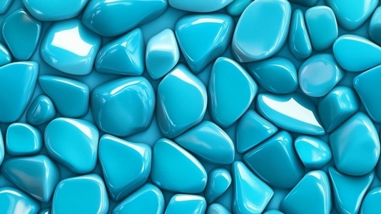 Smooth glossy turquoise stones arranged closely together